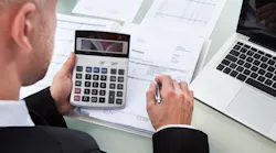 A home builder reviews invoices as part of the value-engineering process.