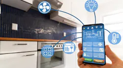 A luxury homeowner uses smart kitchen features on their phone