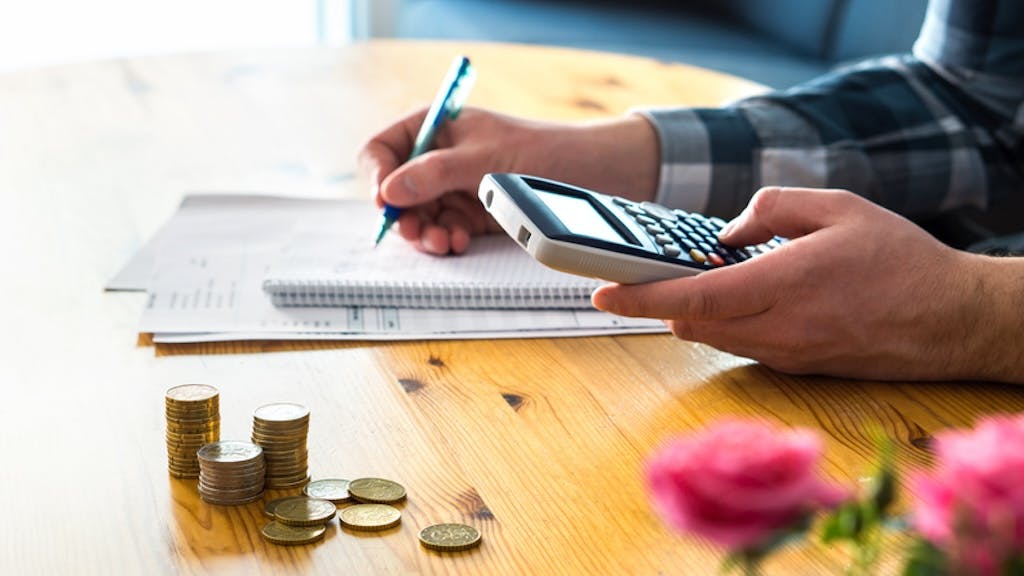 Homebuyer calculating monthly costs