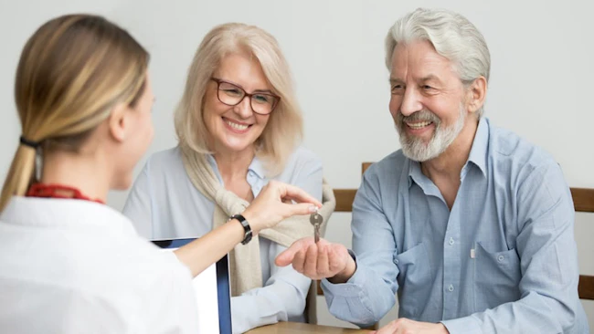 Baby Boomer couple buying new home in hot housing market