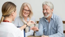 Baby Boomer couple buying new home in hot housing market Baby Boomer couple buying new home in hot housing market