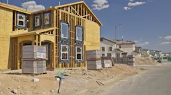 A new home under construction as the price gap between new and existing homes shrinks