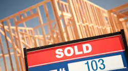 Site of new-construction home with a 'Sold' sign