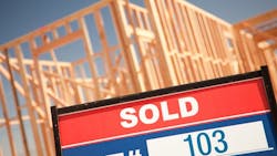 Site of new-construction home with a 'Sold' sign Site of new-construction home with a 'Sold' sign