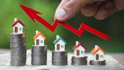 Model homes stacked on coins in ascending order indicate home price growth Model homes stacked on coins in ascending order indicate home price growth