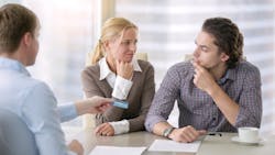 Young couple realizes it is a bad time to buy a home while speaking to a real estate agent Young couple realizes it is a bad time to buy a home while speaking to a real estate agent