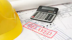 Project plans with a red stamp reading 'Delayed' as the Trump administration's tariffs take effect
