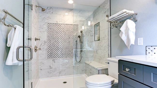 Shower with a built-in bench and accessible plumbing fixtures