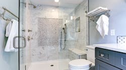 Shower with a built-in bench and accessible plumbing fixtures Shower with a built-in bench and accessible plumbing fixtures