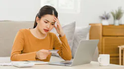 Homebuyer stressed from looking over bills
