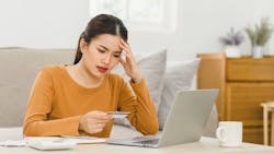 Homebuyer stressed from looking over bills Homebuyer stressed from looking over bills