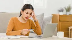 Homebuyer stressed from looking over bills Homebuyer stressed from looking over bills