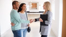 Homebuyers weigh their options with a real estate agent Homebuyers weigh their options with a real estate agent