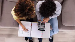First-time homebuyers go over their budgets to determine if they can afford to buy a home