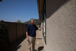 KB Homes' Steve Ruffner inspects a new home at Dixon Trail, which features dual-paned tempered windows, among other fire-resistant features. | Photo: Adriana Heldiz/CalMatters KB Homes' Steve Ruffner inspects a new home at Dixon Trail, which features dual-paned tempered windows, among other fire-resistant features. | Photo: Adriana Heldiz/CalMatters