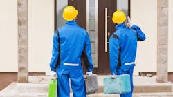 Two construction workers at a jobsite Two construction workers at a jobsite
