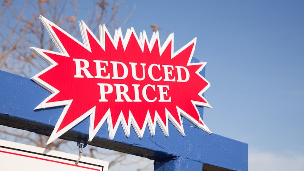A 'Reduced Price' sign, indicating that a seller has cut the price on their home