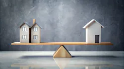 Houses on a scale indicate a balanced housing market