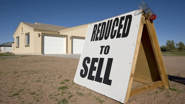 Weakened demand from buyers is causing sellers to reduce prices and sell their homes at a loss.