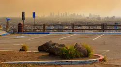 Los Angeles city skyline in orange haze caused by wildfire