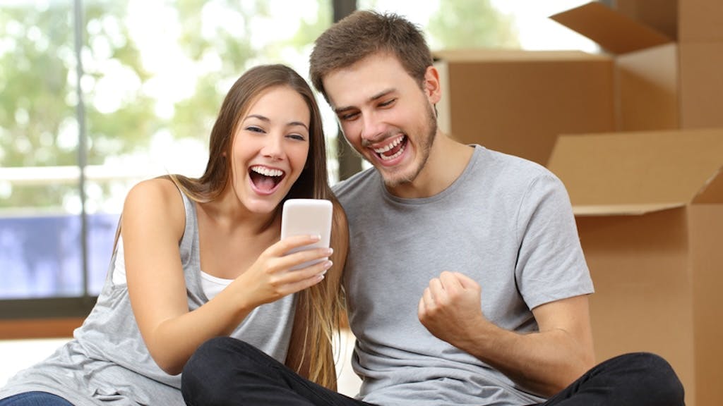 Young homebuyers celebrate their purchase