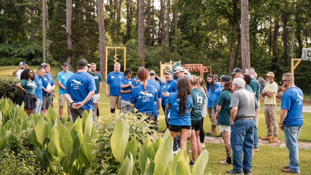 David Weekley Homes and HomeAid Georgia volunteers gather outside Atlanta shelter