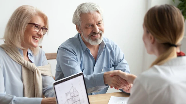 Retired couple meets with a real estate agent