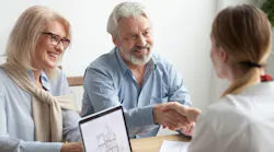 Retired couple meets with a real estate agent