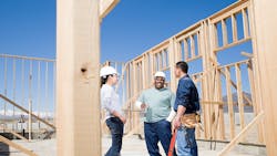 Home builders conversating at jobsite Home builders conversating at jobsite