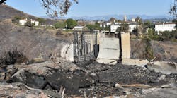 Home damaged by wildfire in California Home damaged by wildfire in California