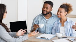 Millennial homebuyers meet with real estate agent Millennial homebuyers meet with real estate agent