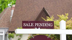'Sale Pending' sign in front of single-family home