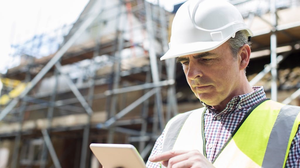 A builder multi-tasking at work