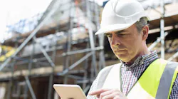 A builder multi-tasking at work