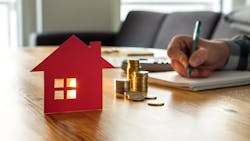 Homebuyer making a mortgage payment Homebuyer making a mortgage payment