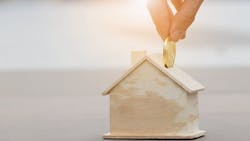 Concept putting money into a house Concept putting money into a house