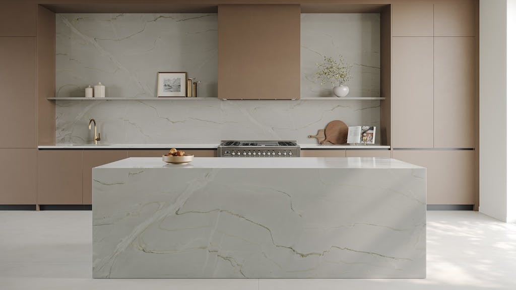 Kitchen with evenly spaced recessed lights highlighting countertops and backsplash