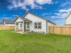 Taylor Morrison’s model at Mason Woods in Cypress, Tex., keeps the backyard simple with a modest covered patio, while the 120-foot-deep lots give owners a ample open-air outdoor space. Taylor Morrison’s model at Mason Woods in Cypress, Tex., keeps the backyard simple with a modest covered patio, while the 120-foot-deep lots give owners a ample open-air outdoor space.