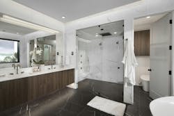 This bathroom seamlessly merges contemporary design with organic allure. The focal point is a breathtaking floating double sink vanity, adorned with captivating wood grain cabinets from Wellborn Cabinet, Inc. The rich textures and natural hues of the wood grain cabinets create a soothing ambiance, evoking a sense of warmth and serenity. The floating design adds an element of modern elegance, giving the room an airy and spacious feel. With ample storage space, the vanity effortlessly combines functionality and style. This bathroom seamlessly merges contemporary design with organic allure. The focal point is a breathtaking floating double sink vanity, adorned with captivating wood grain cabinets from Wellborn Cabinet, Inc. The rich textures and natural hues of the wood grain cabinets create a soothing ambiance, evoking a sense of warmth and serenity. The floating design adds an element of modern elegance, giving the room an airy and spacious feel. With ample storage space, the vanity effortlessly combines functionality and style.