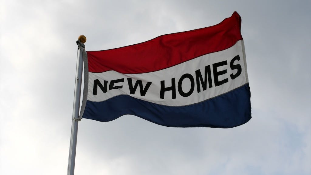 Flag reading 'New Homes'