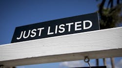 A closeup of a sign that reads 'Just Listed,' indicating that a home was made available for sale A closeup of a sign that reads 'Just Listed,' indicating that a home was made available for sale