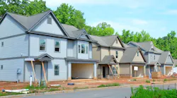 A row of newly completed single-family homes