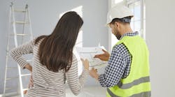 Home builder shows design concepts to client Home builder shows design concepts to client