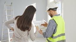 Home builder shows design concepts to client Home builder shows design concepts to client