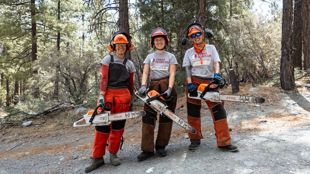 Team Rubicon volunteers holding chainsaws from STIHL