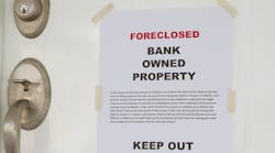 Foreclosure notice on the front door of a home Foreclosure notice on the front door of a home