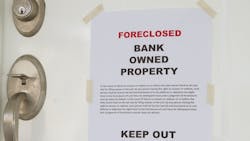 Foreclosure notice on the front door of a home Foreclosure notice on the front door of a home