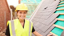 A female construction worker at a jobsite A female construction worker at a jobsite