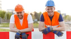 Two construction workers smiling for photo Two construction workers smiling for photo
