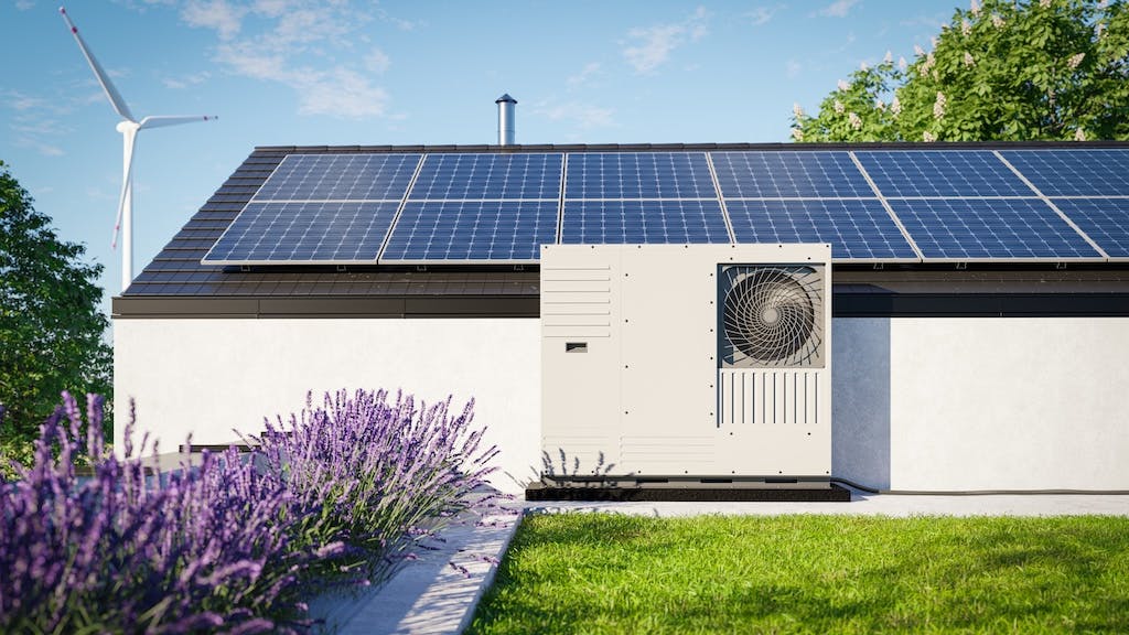 A home with solar panels and a heat pump
